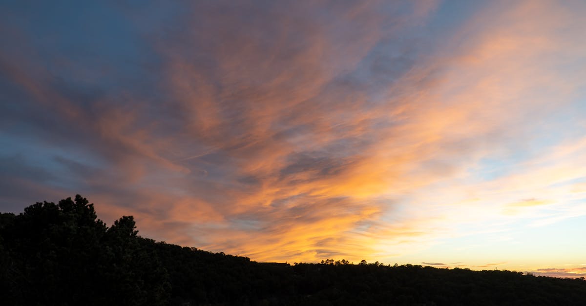 Breathtaking sunset with vivid clouds over the hills of Santa Fe, New Mexico.