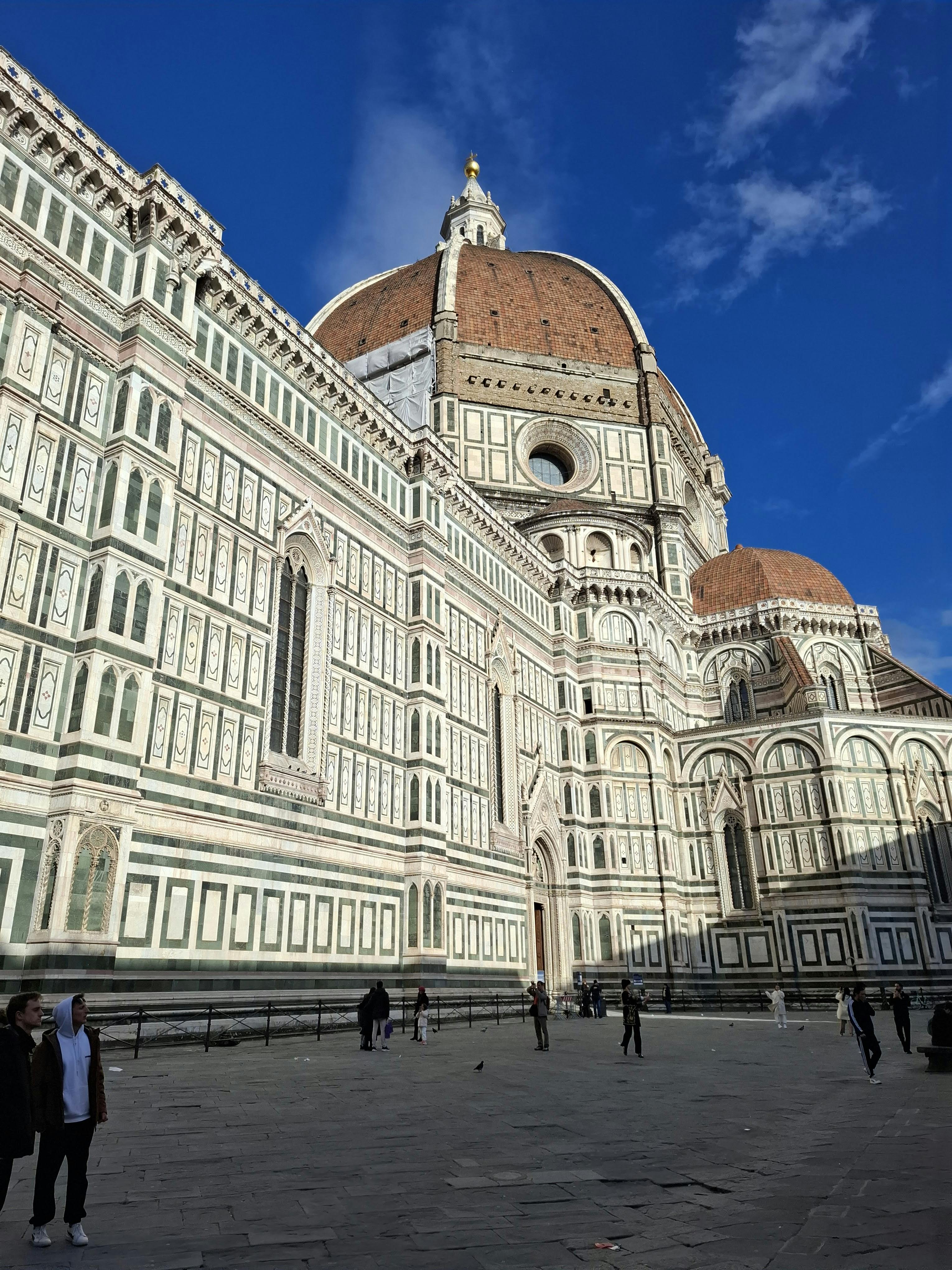 Stunning view of Florence Cathedral under a clear blue sky in Italy.