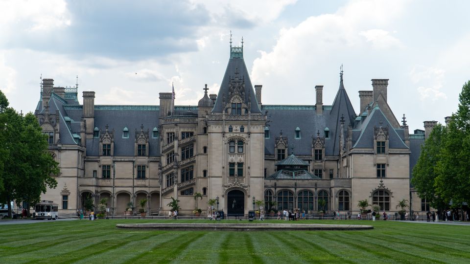 Elegant view of the Biltmore Estate, Asheville, NC, showcasing grand architecture and landscaped grounds.