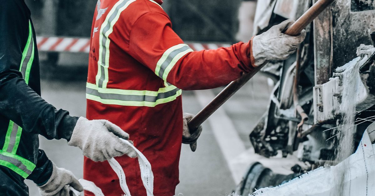 Worker Handling Construction Workers Handling Materials Safely · Free Stock Photo