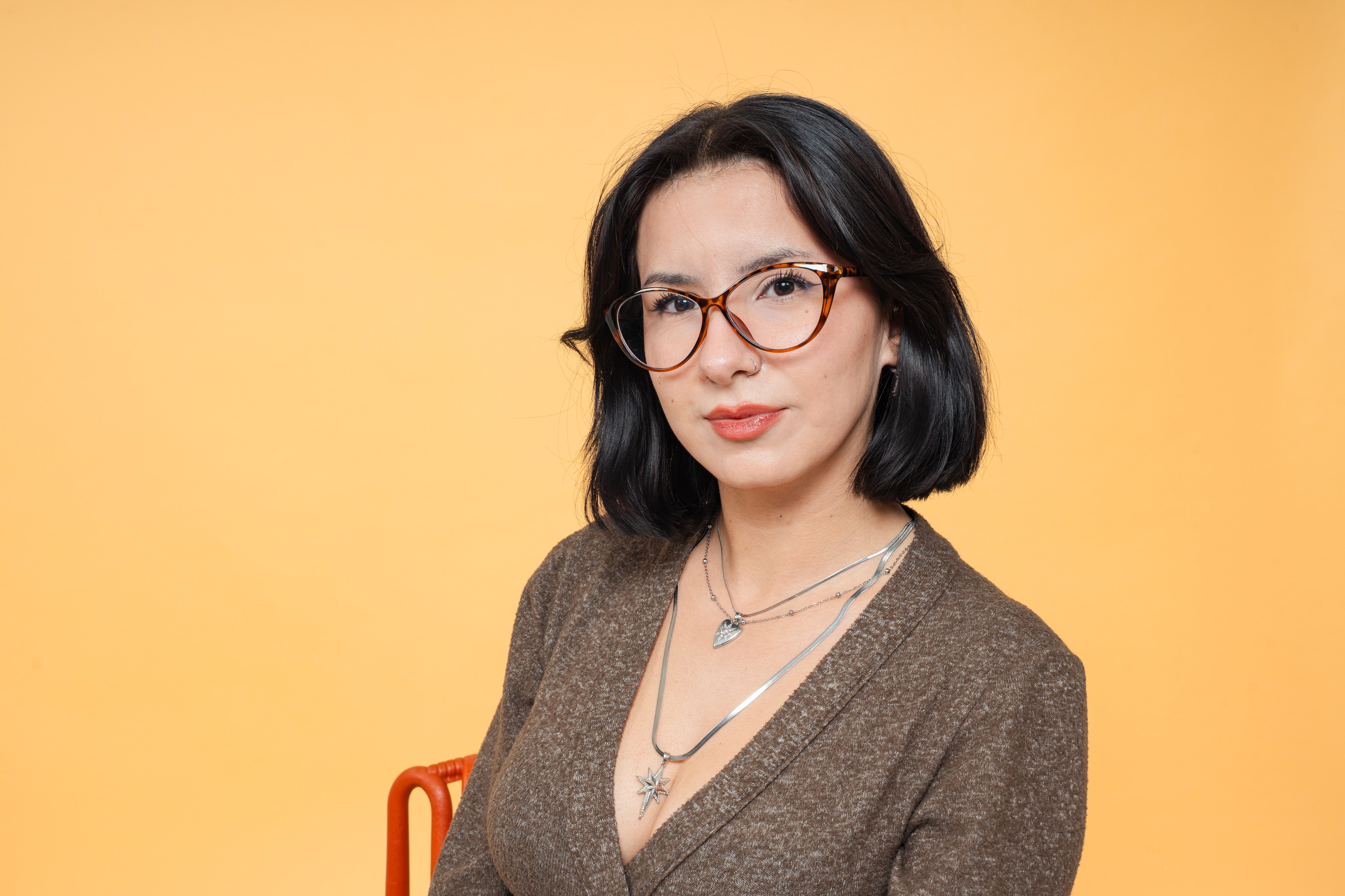 Portrait of a Woman with Short Black Hair and Glasses · Free Stock Photo