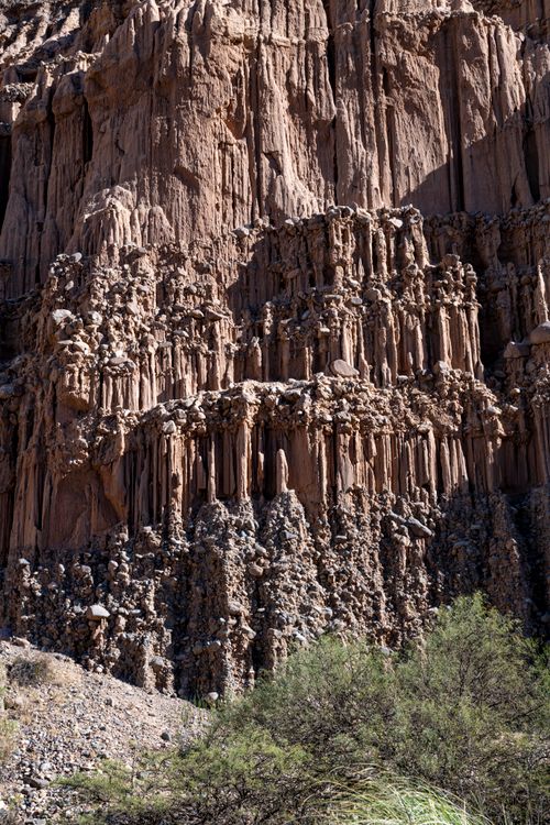 Free Magnificent cliff formations under bright sunlight, showcasing geological patterns in a desert landscape. Stock Photo