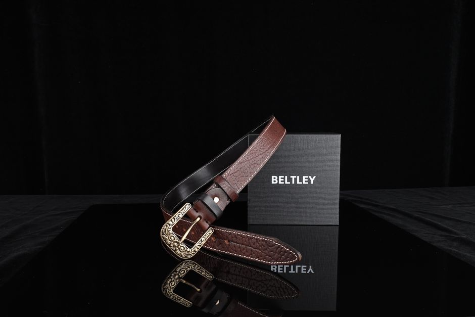 Style shot of a western belt paired with dark selvedge denim and boots Style shot of a western belt paired with dark selvedge denim and boots