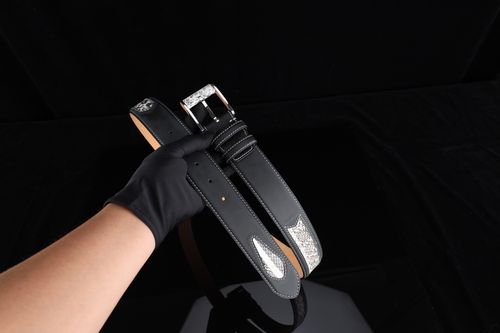 Free Stylish black leather belt with rhinestone decor, ideal for formal occasions and fashion gifts. Stock Photo