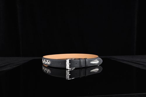 Free Stylish black leather belt featuring intricate design elements and silver buckle, perfect for fashion accessories. Stock Photo
