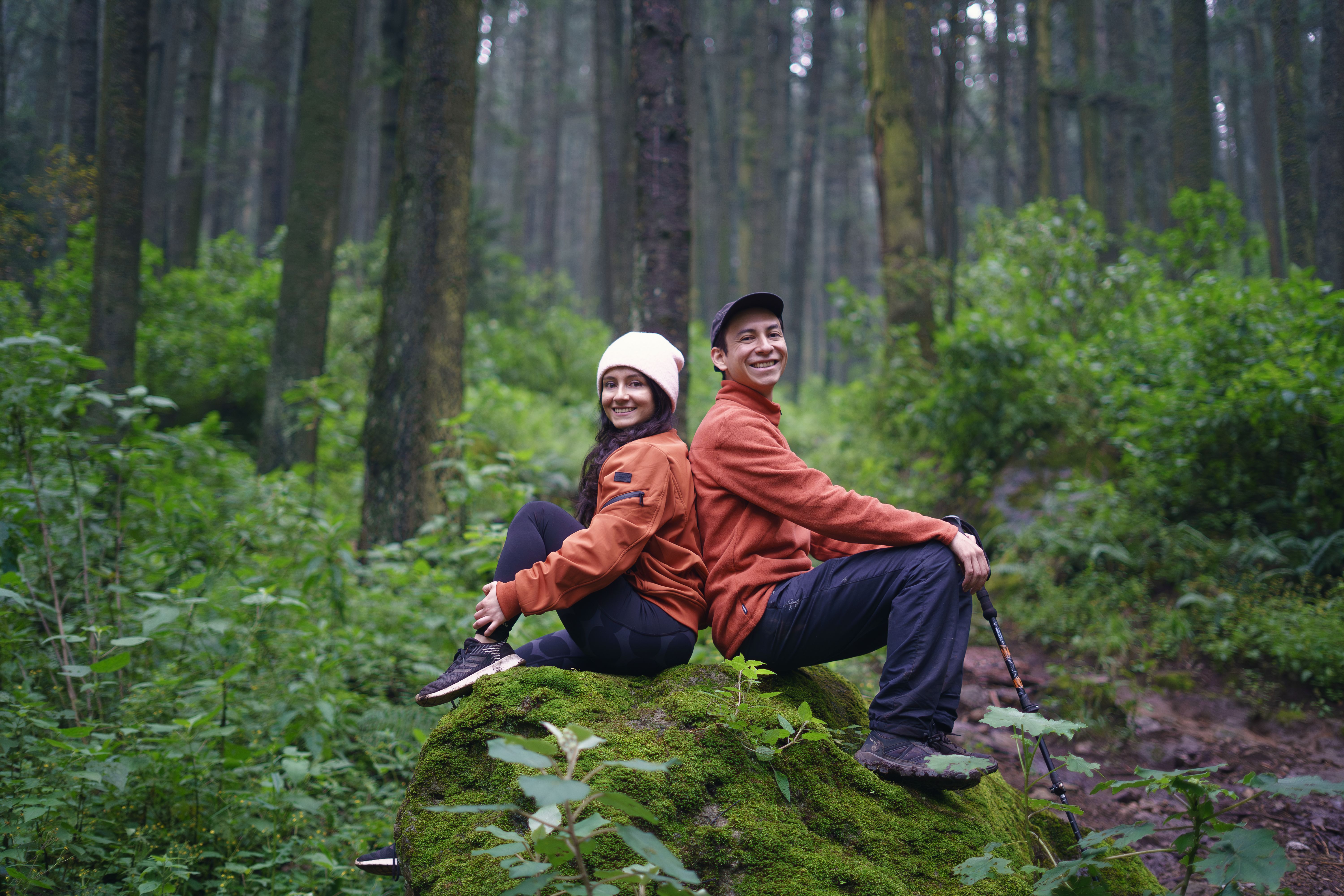 Happy Hikers Enjoying Nature in Lush Forest