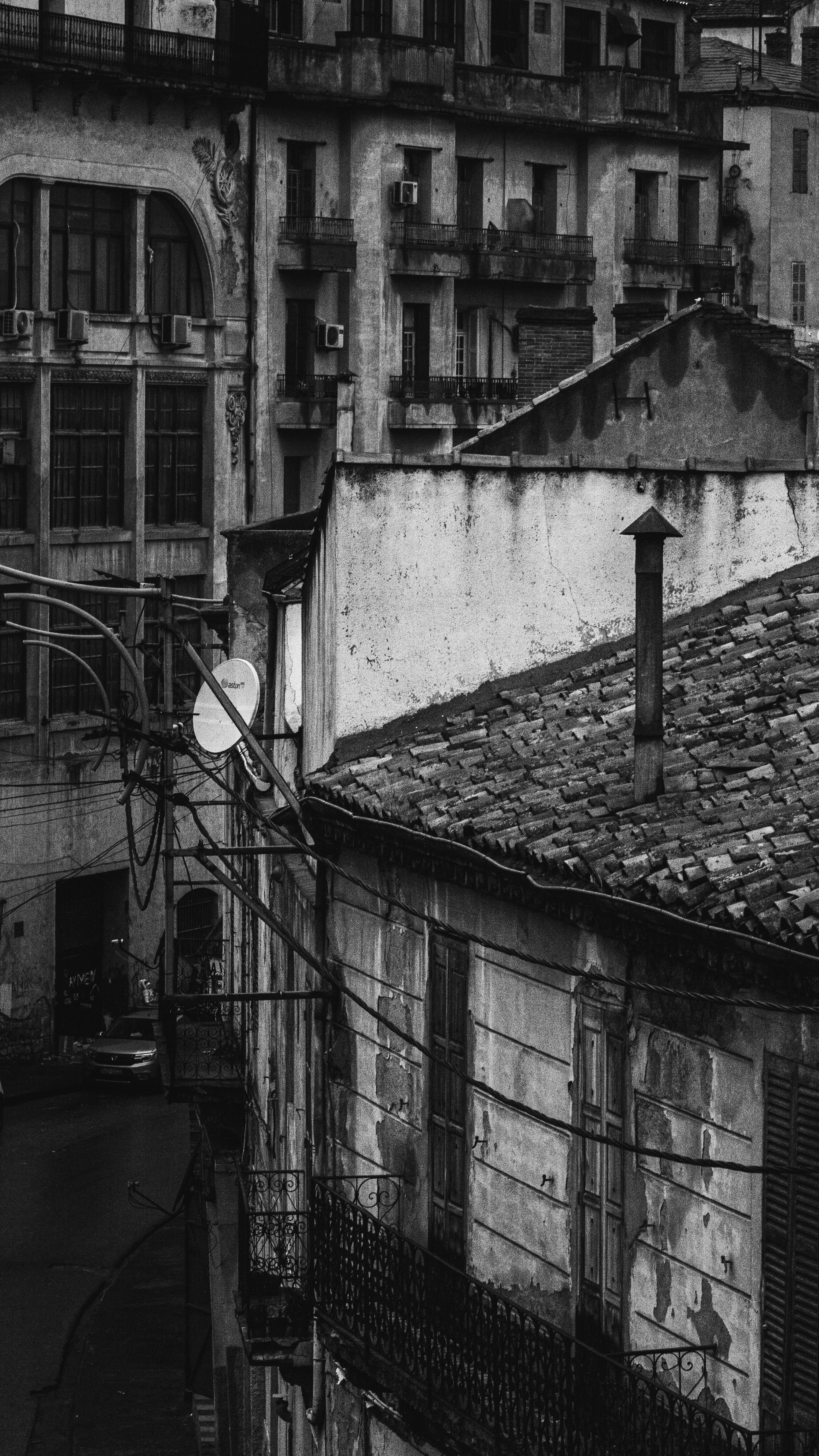Explore the historic architecture and urban landscape of Constantine, Algeria in this monochrome photograph.