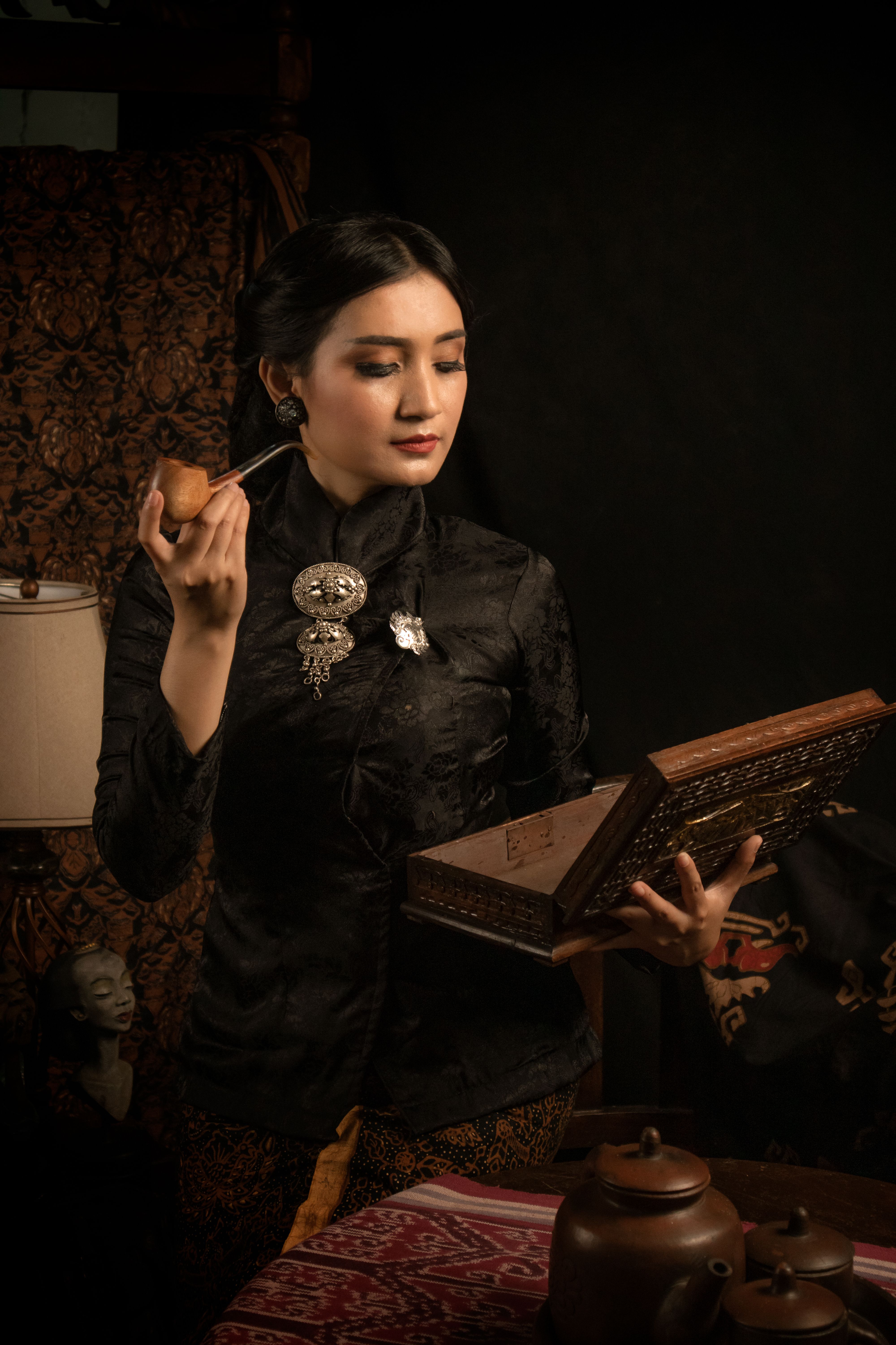 Traditional Javanese Woman with Teapot and Box · Free Stock Photo
