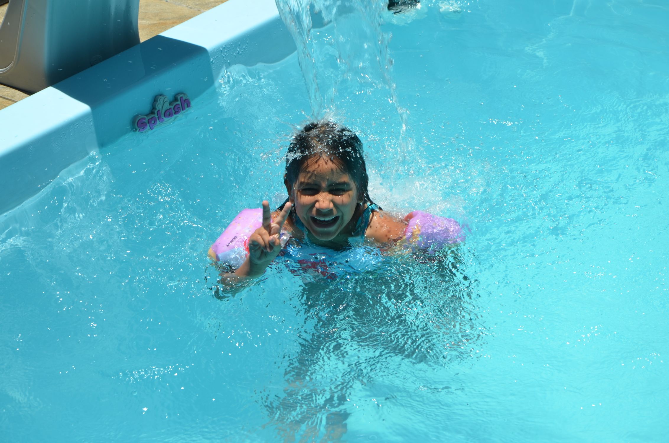 Pool Side Positive Image Child Enjoying Summer Pool Day with Splash · Free Stock Photo