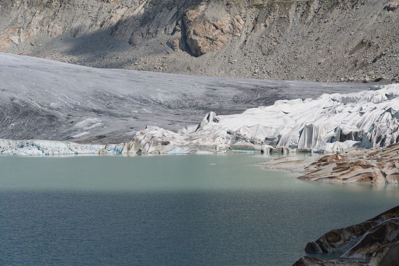 Swiss glacier under cloud — photo by Jean-Paul Wettstein on Pexels