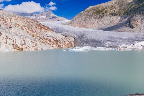 Free Stunning view of the Rhone Glacier and glacial lake in the scenic Swiss Alps. Stock Photo