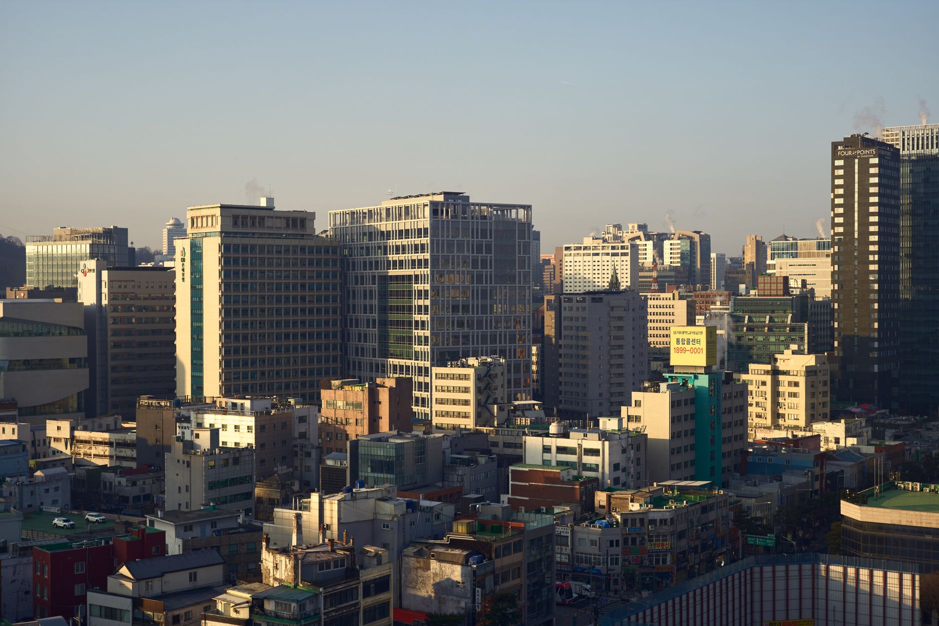 Skyscrapers and bustling streets in the Gangnam business district of Seoul, South Korea.
