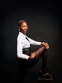 Stylish woman posing confidently in modern fashion attire, ideal for fashion or lifestyle themes.