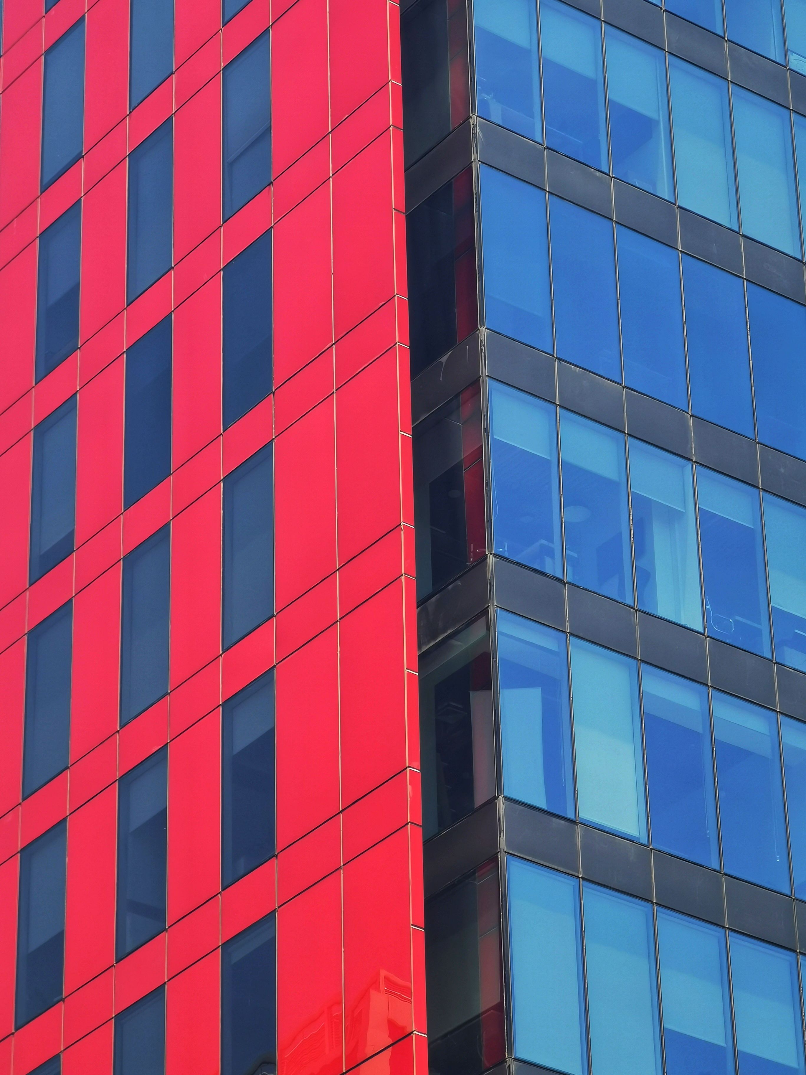 Modern Red and Blue Skyscraper Architecture · Free Stock Photo