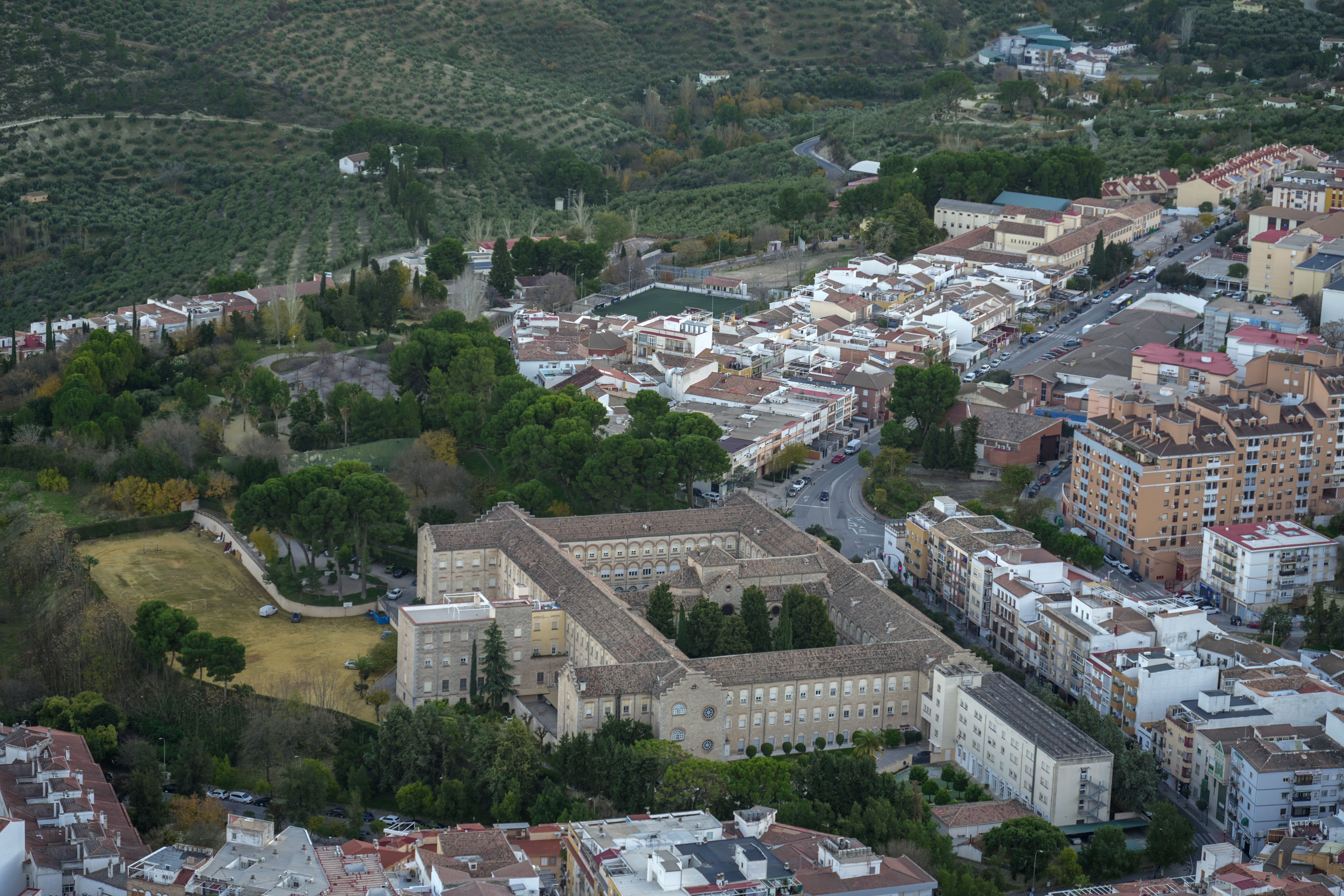 Discover the picturesque aerial landscape of Jaén, Spain, showcasing historic architecture and lush greenery.