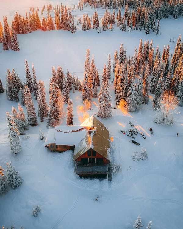 Aerial Photography of House, Field, and Trees Covered With Snow