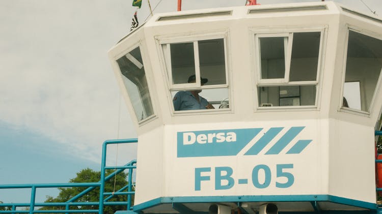 Man Standing In Dersa Fb-05 Guard House Under White And Blue Sky