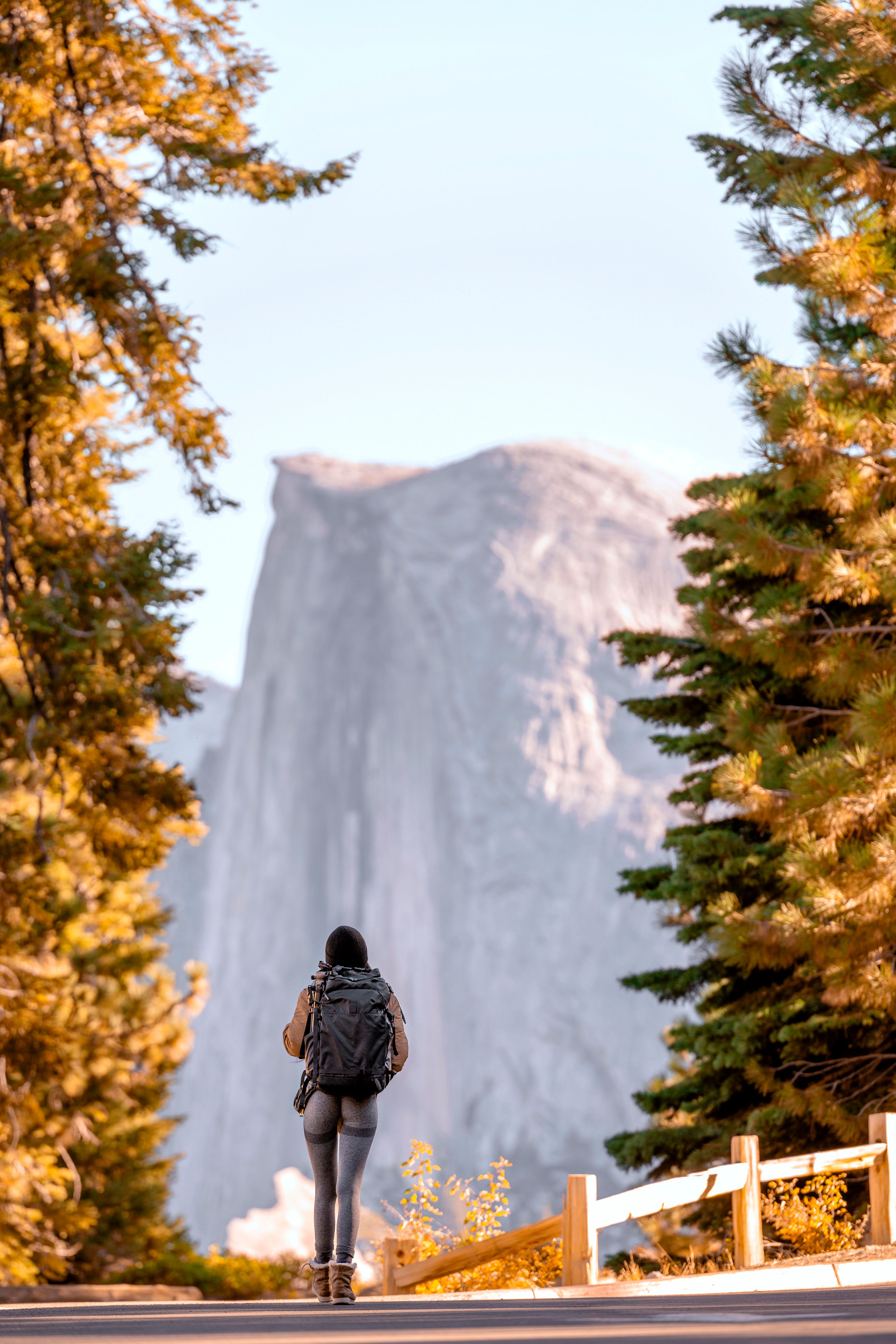 Hiker Facing Half Dome in Yosemite National Park · Free Stock Photo