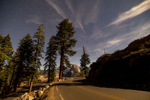 Free Scenic view of Half Dome beneath a starry night sky at Yosemite National Park. Stock Photo