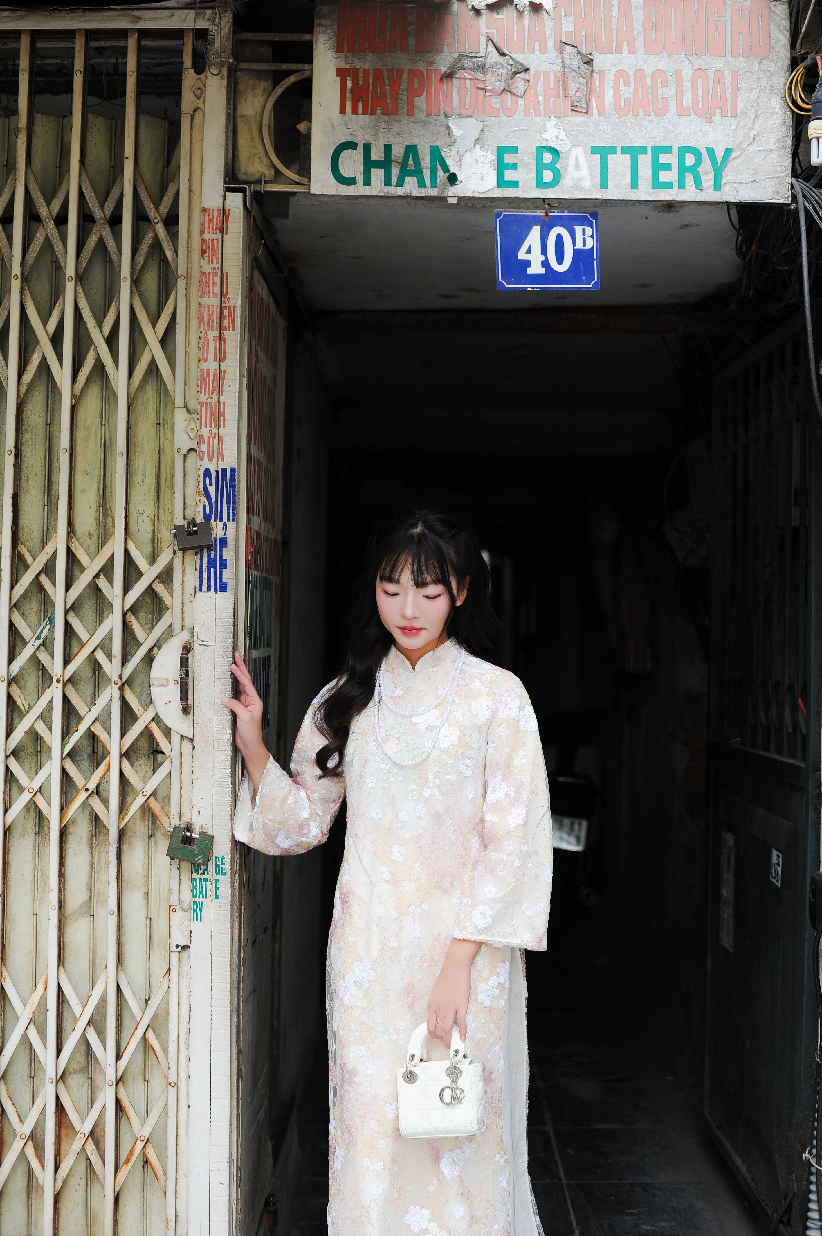 Woman in Traditional Dress Standing in Doorway · Free Stock Photo