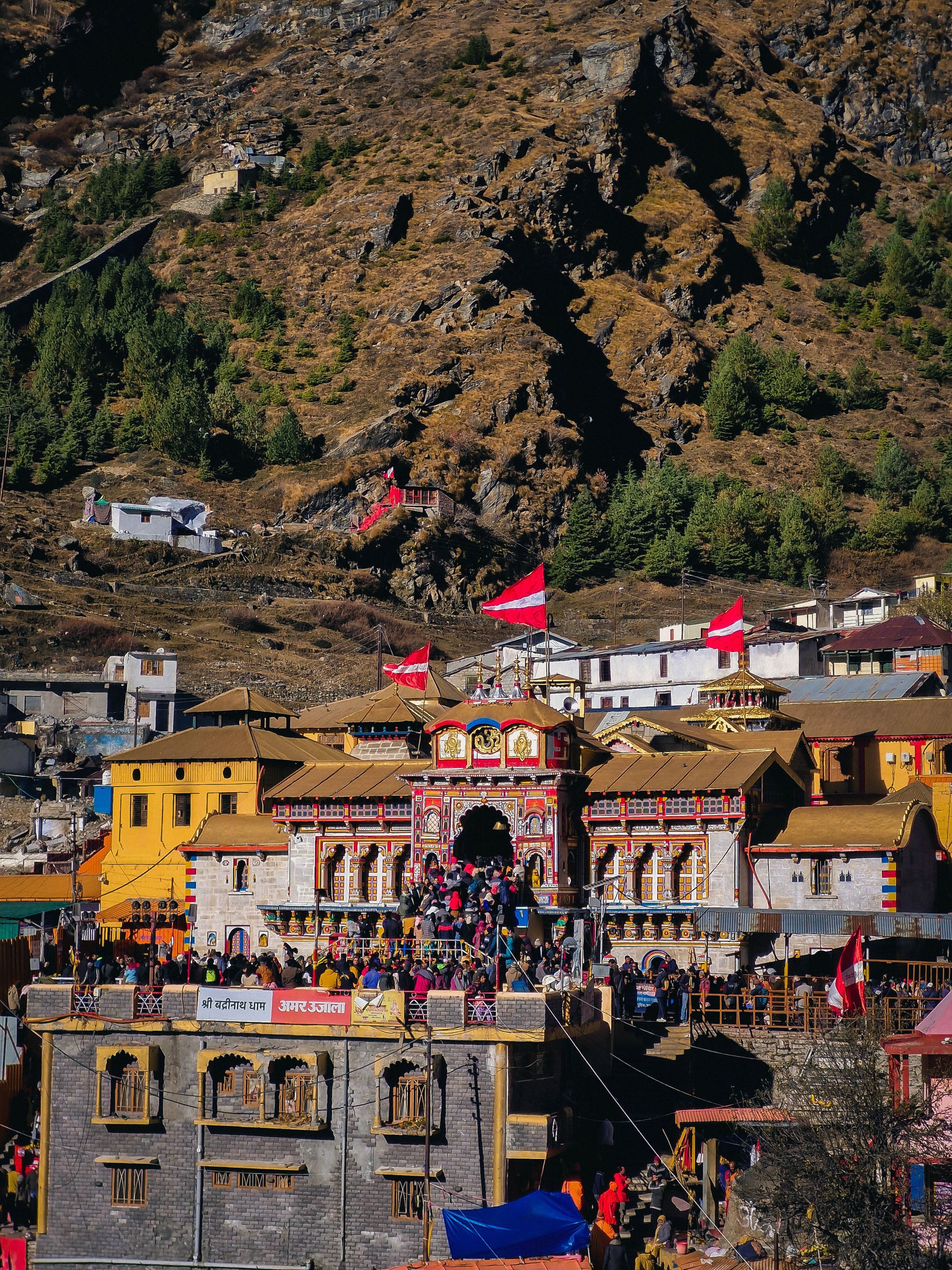 Colorful Badrinath Temple surrounded by Himalayan mountains, Uttarakhand