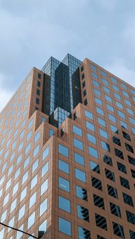 A modern skyscraper in Toronto, capturing urban architecture against a clear sky.