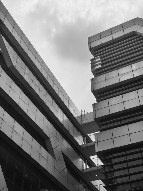 Free Brutalist high-rise with geometric lines and contrasting facade in New Delhi. Stock Photo