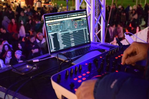 Free Vibrant outdoor night DJ performance with an engaged crowd and professional equipment. Stock Photo