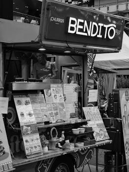 Mexican street food truck offers tasty churros and tacos with vibrant menus.