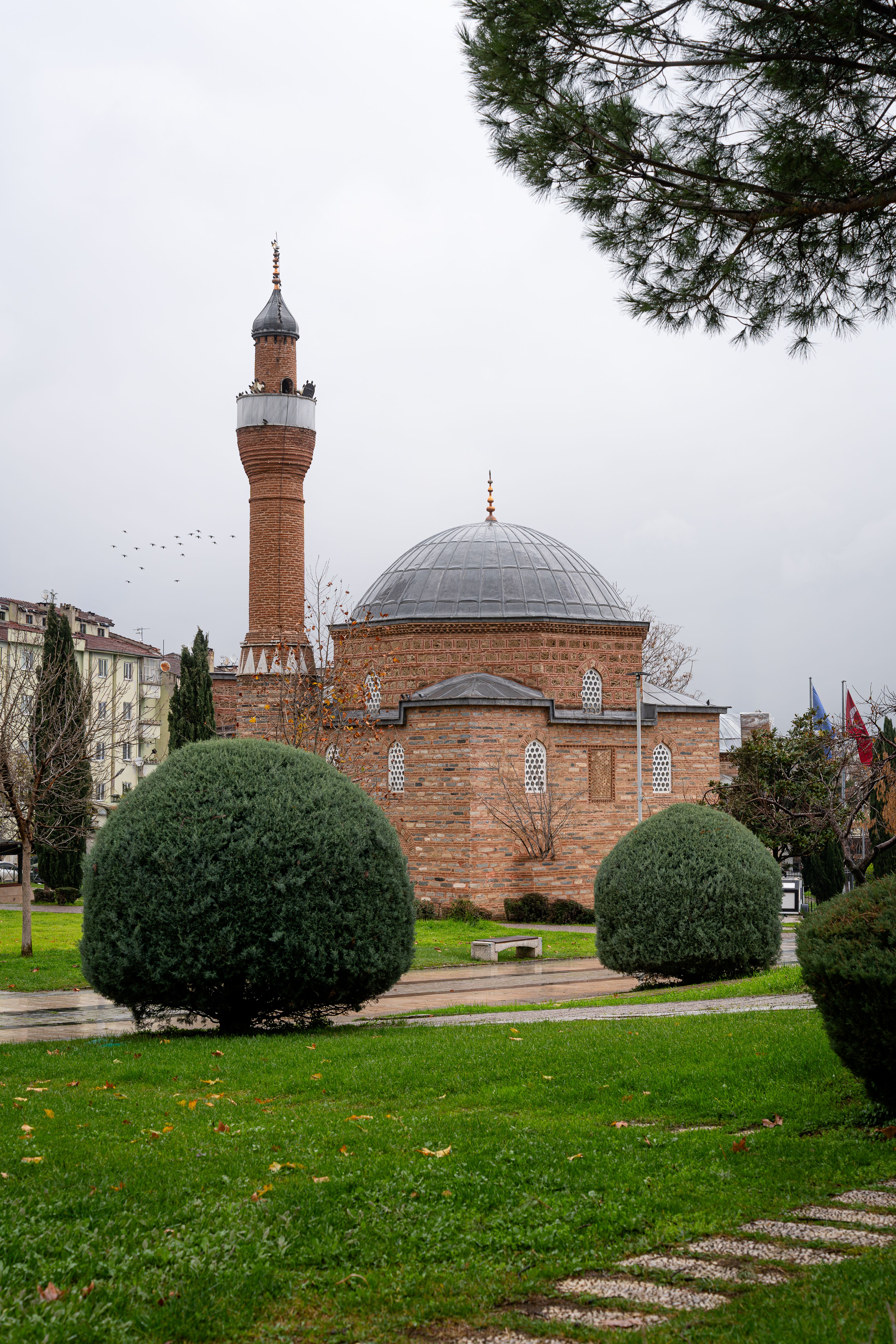 Historic Brick Mosque with Minaret in Park Setting · Free Stock Photo