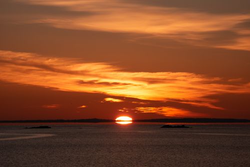 Free Captivating winter sunrise in Stamford, Connecticut with vibrant colors over the calm sea. Stock Photo