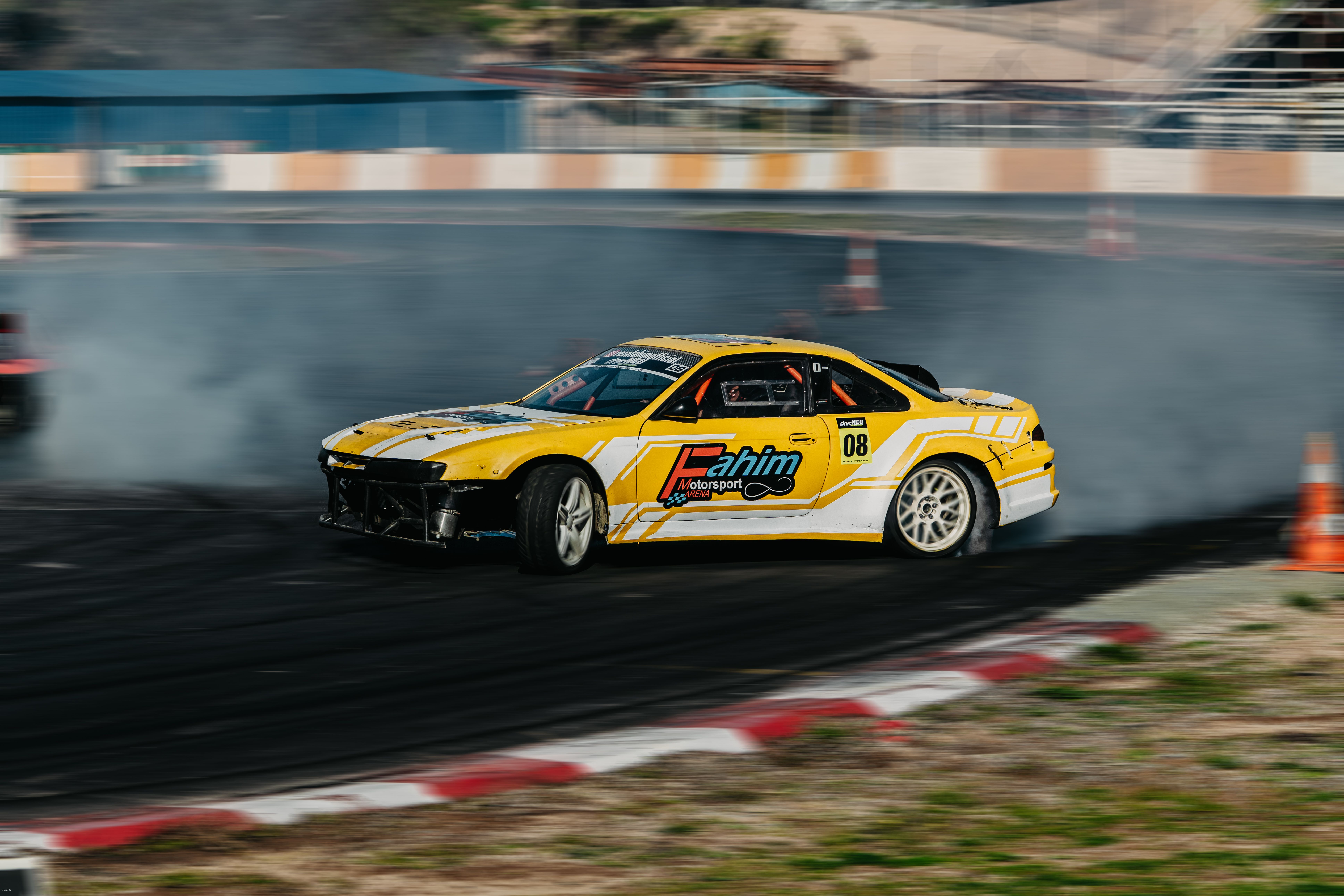 Vibrant Yellow Drift Car on Race Track · Free Stock Photo