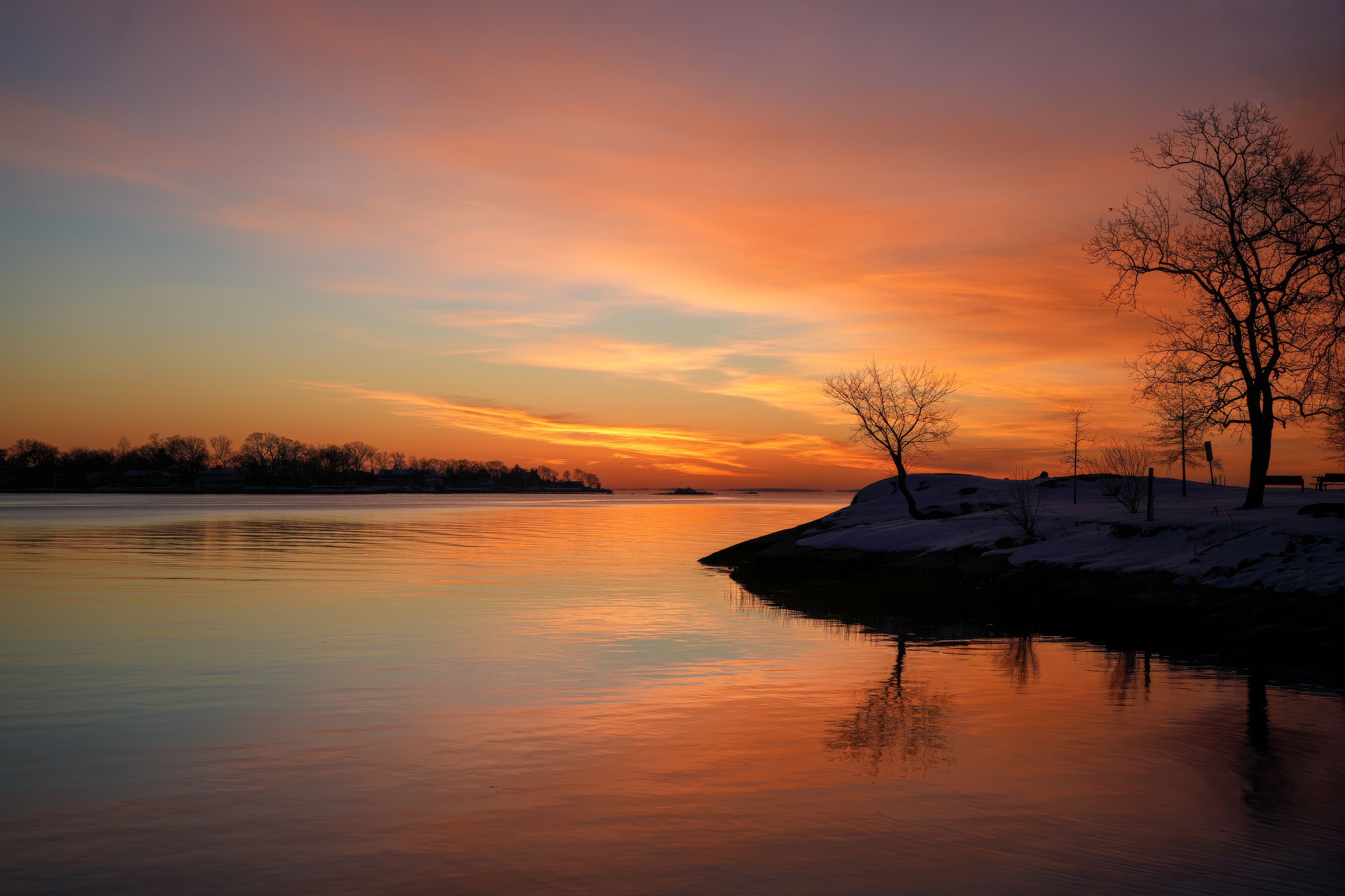 Serene Sunset Over Calm Lake Waters · Free Stock Photo