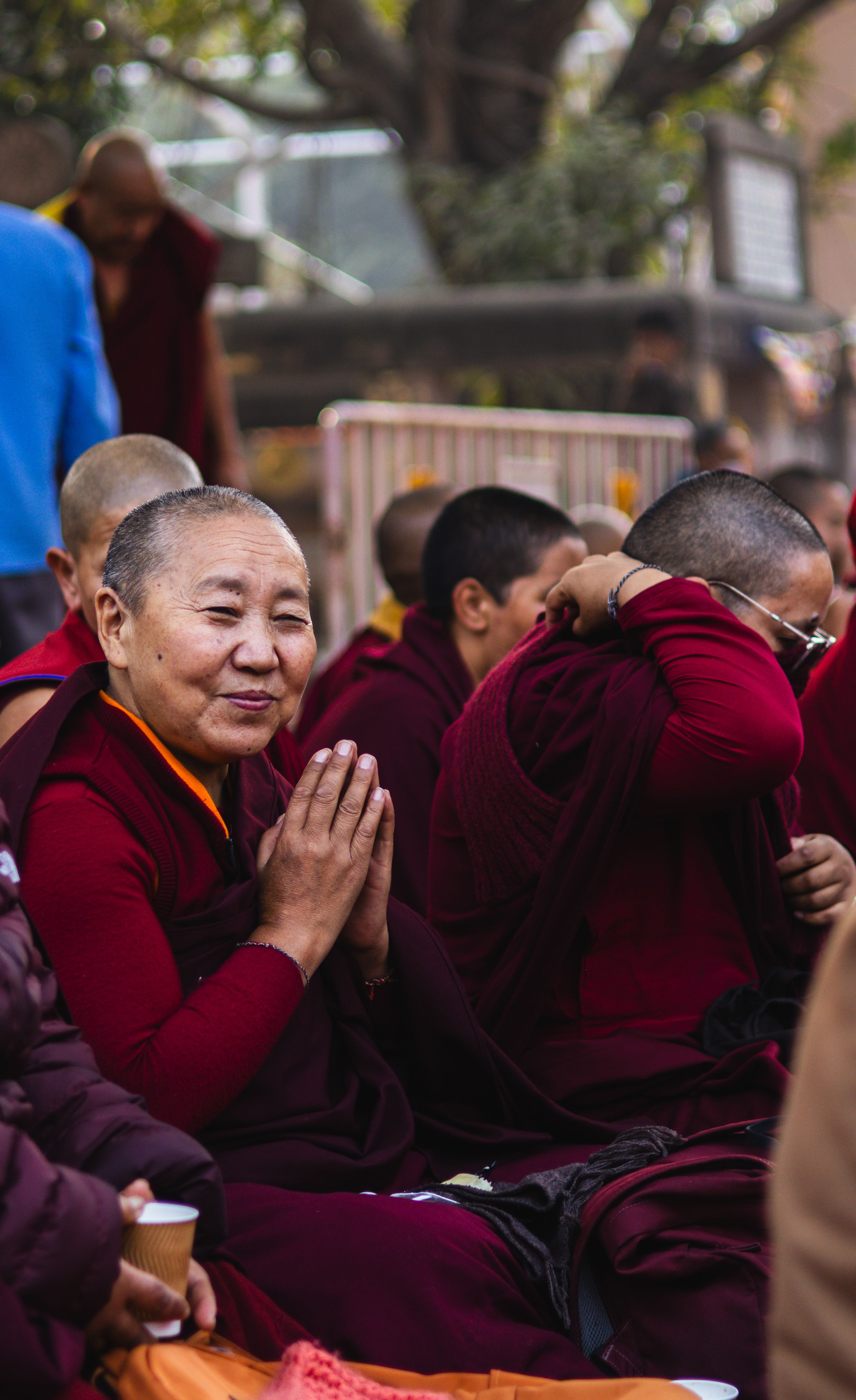 Group of Monks Meditating in Outdoor Gathering · Free Stock Photo
