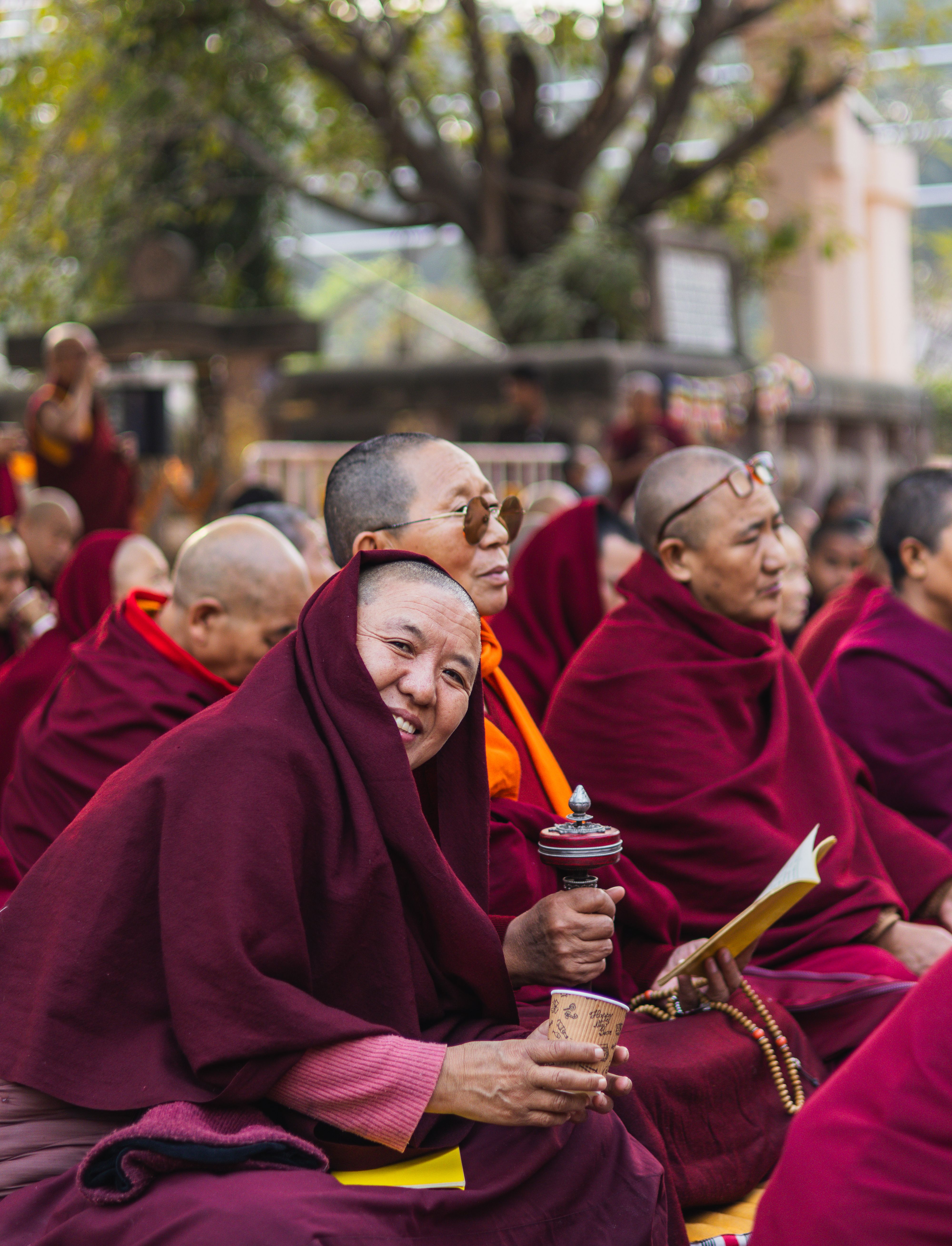 Monks in Red Robes Meditating Outdoors · Free Stock Photo