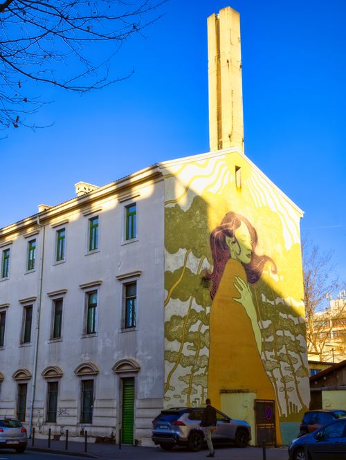 Free A vibrant mural on a building facade in Rijeka, Croatia, under a clear blue sky. Stock Photo