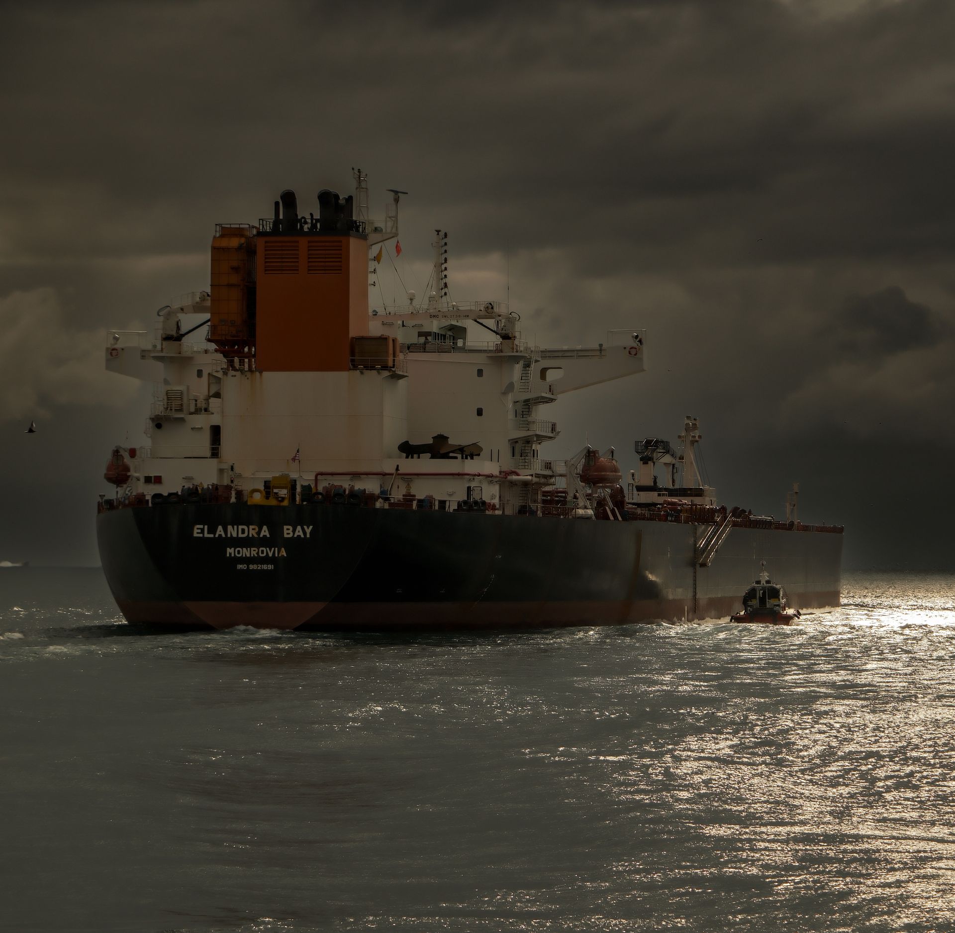 An oil tanker on a grey sea under an overcast sky