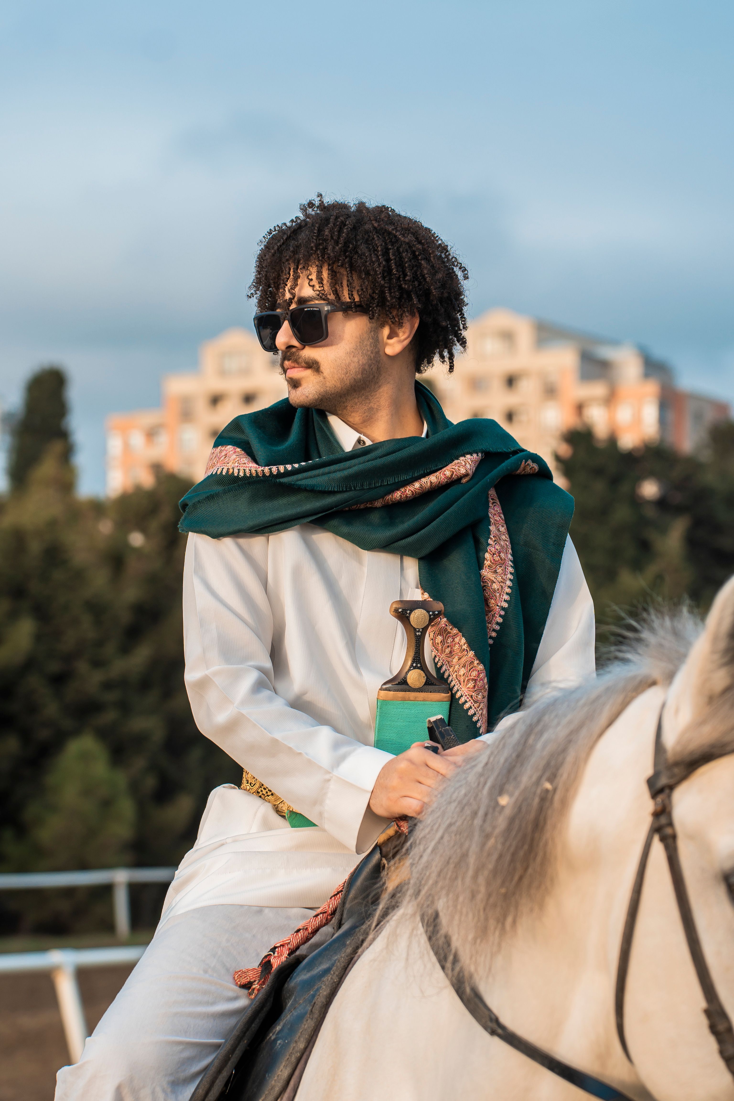 Man in Traditional Attire Horseback Riding Outdoors · Free Stock Photo