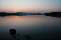 Serene Lake at Twilight with Scenic Reflections