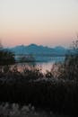 Serene Lake View with Mountain Silhouettes at Sunset