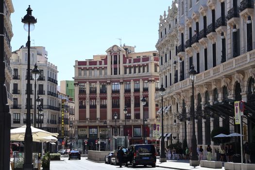 Beautiful European city street featuring classic architecture and bustling urban life.