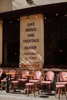 Brussels cafe with outdoor seating under warm light, offering a rustic European ambiance.