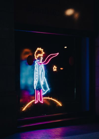 Neon light figure in the dark, photo by Olivia on Pexels