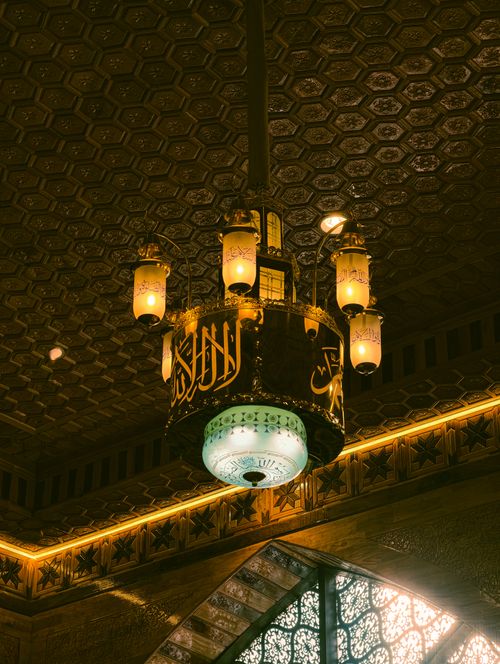 Free Elegant chandelier with Arabic script in a Srinagar mosque, showcasing intricate Islamic architecture. Stock Photo