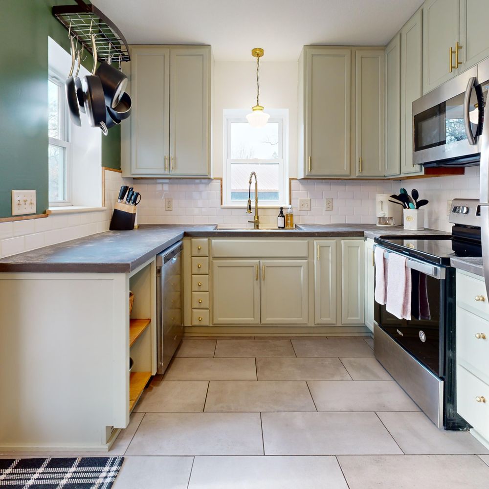 Kitchen Spraying in Woodford Bridge — quality trade paint going on in two coats