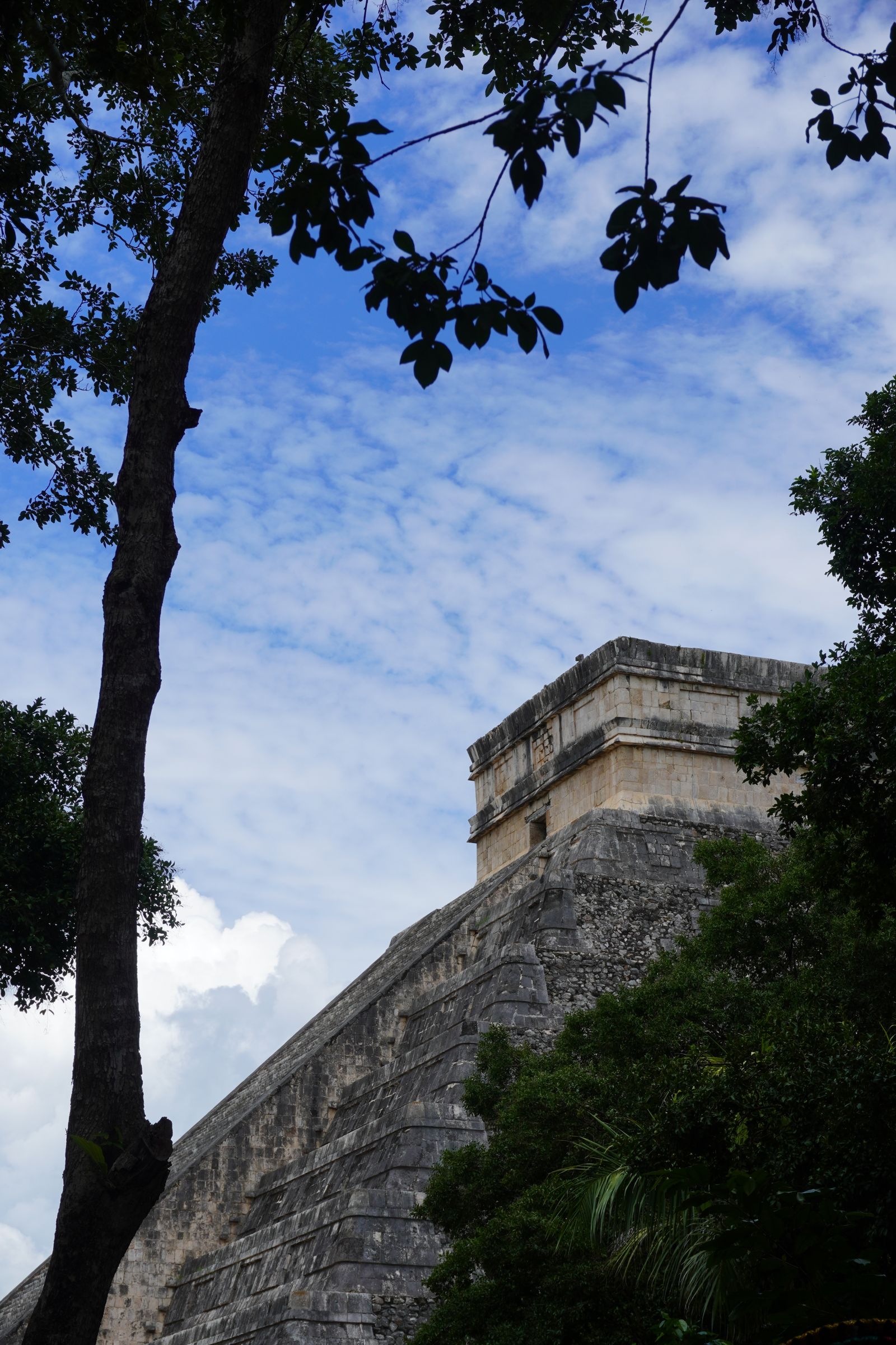 The Pyramid of Kukulcán at Chichén Itzá against a clear blue sky