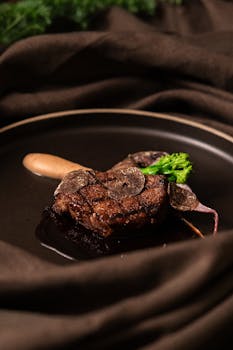 Exquisite gourmet steak with truffles and garnish, presented elegantly in a Tokyo restaurant.