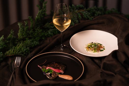 Elegant dining setup with gourmet meal and wine in a Tokyo restaurant.