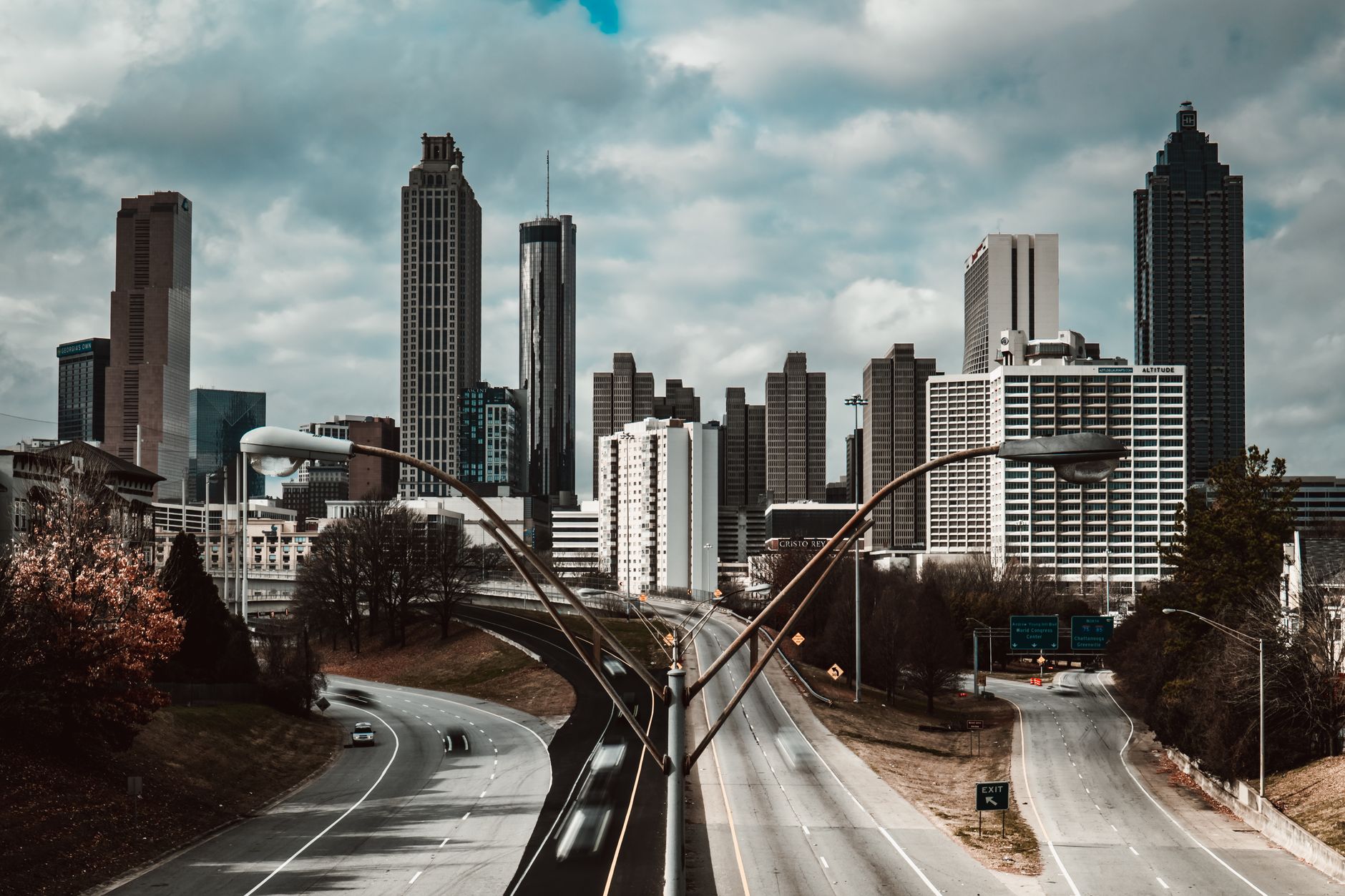 Door hanger delivery in Jackson, MS Door hanger distribution and flyer delivery in Jackson, MS — Stunning view of Atlanta skyline from Jackson Street Bridge on a cloudy day. above neighborhoods DoorBlitz crews walk