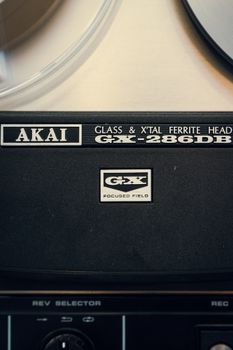 Detailed shot of an Akai GX-286DB reel-to-reel tape recorder showcasing vintage audio technology.
